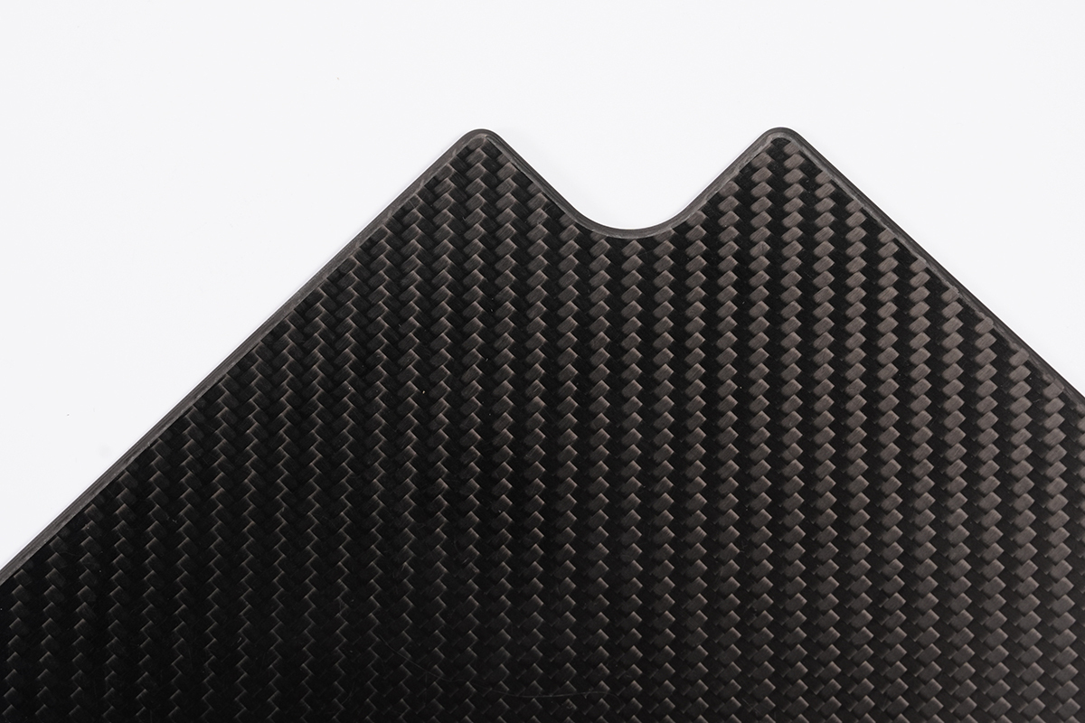 Close-up of twill carbon fiber sheet surface